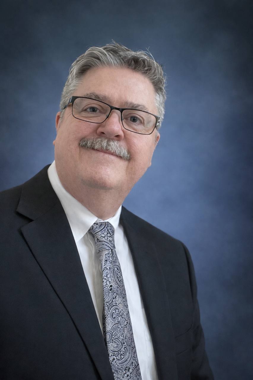 Professional headshot of John Foreman